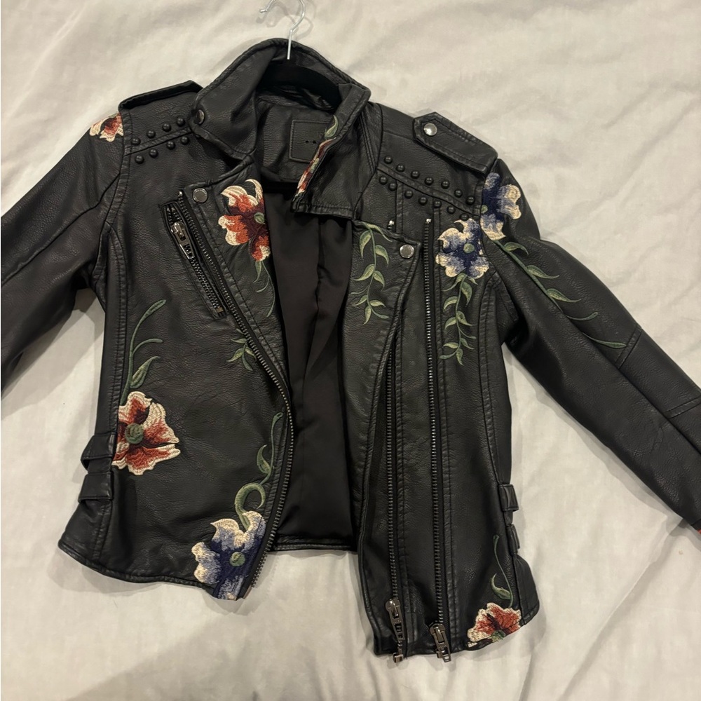 BlankNYC leather biker jacket with flower details and studs